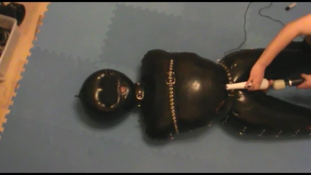 Slave is in the inflatable rubbersuit