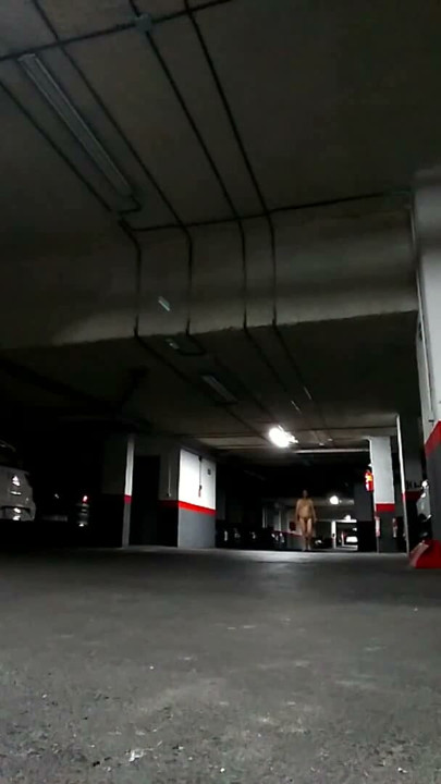 Naked in an underground parking lot