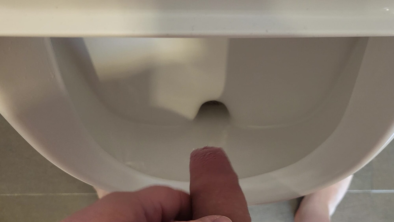 Man pee in urinal
