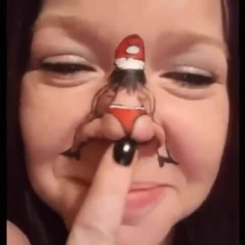 Dancing Santa on girl's nose