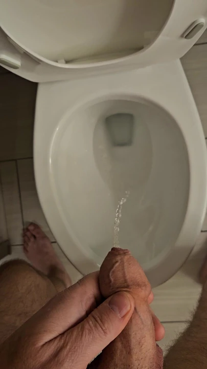 Hard small uncut dick peeing