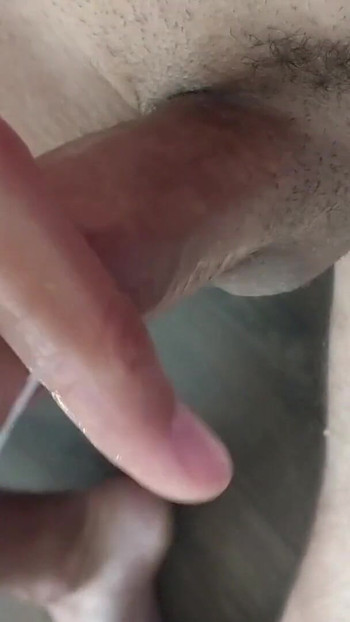 Key moment from "Closeup huge thick cumshot masturbate uncut cock"