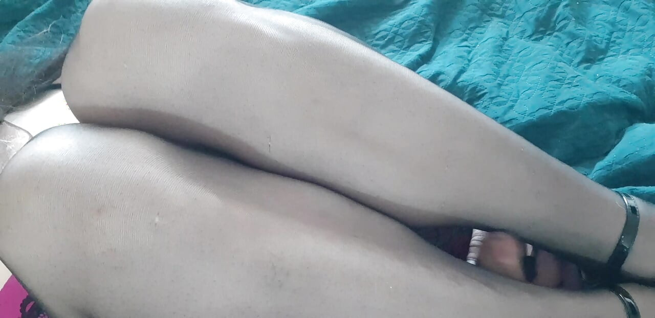 Cock between nylon legs