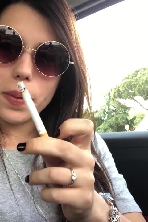 Petra smoking in car