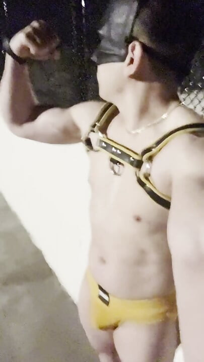Midnight Muscle Tease: Asian Hunk Flexes Ass & Biceps in Yellow Harness on Highway Bridge