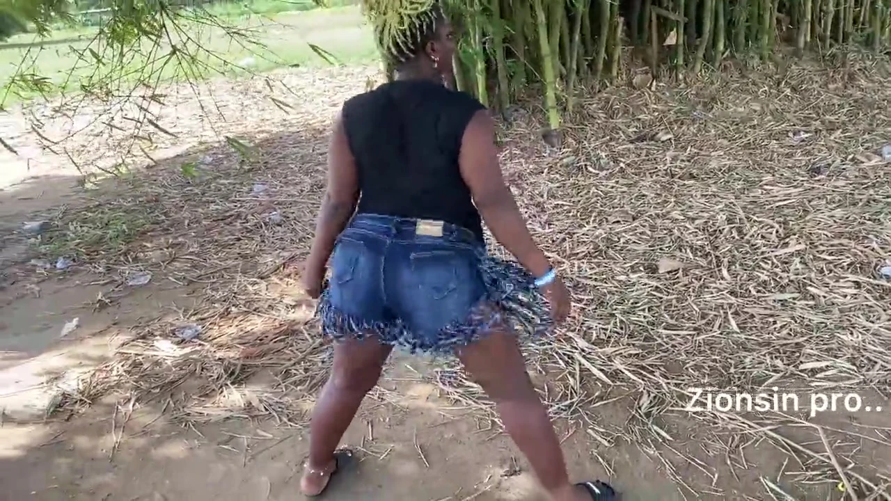 Ebony sexy black girl dances in outdoor with much laughter