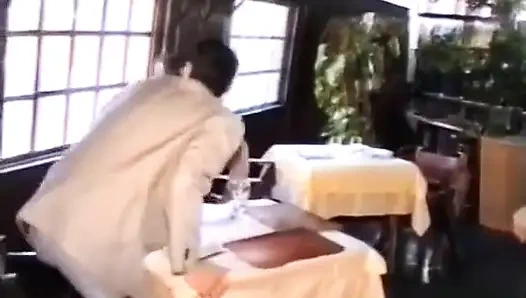 A Cook Is Cut by Her Customers in the Kitchen.