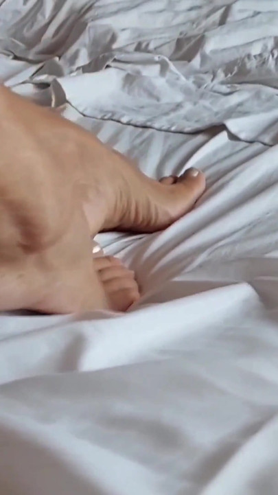 Selena's relaxing and bed with foot worship