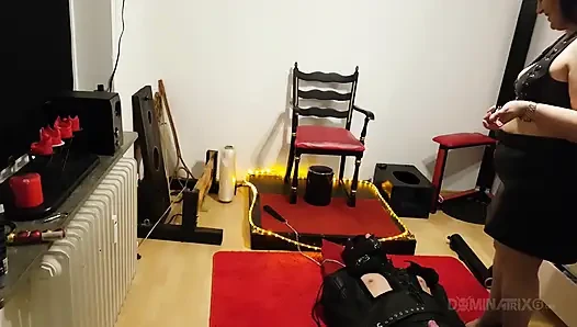 Curvy Brunette Dominatrix Commands Bound Slave in Fetish Dungeon