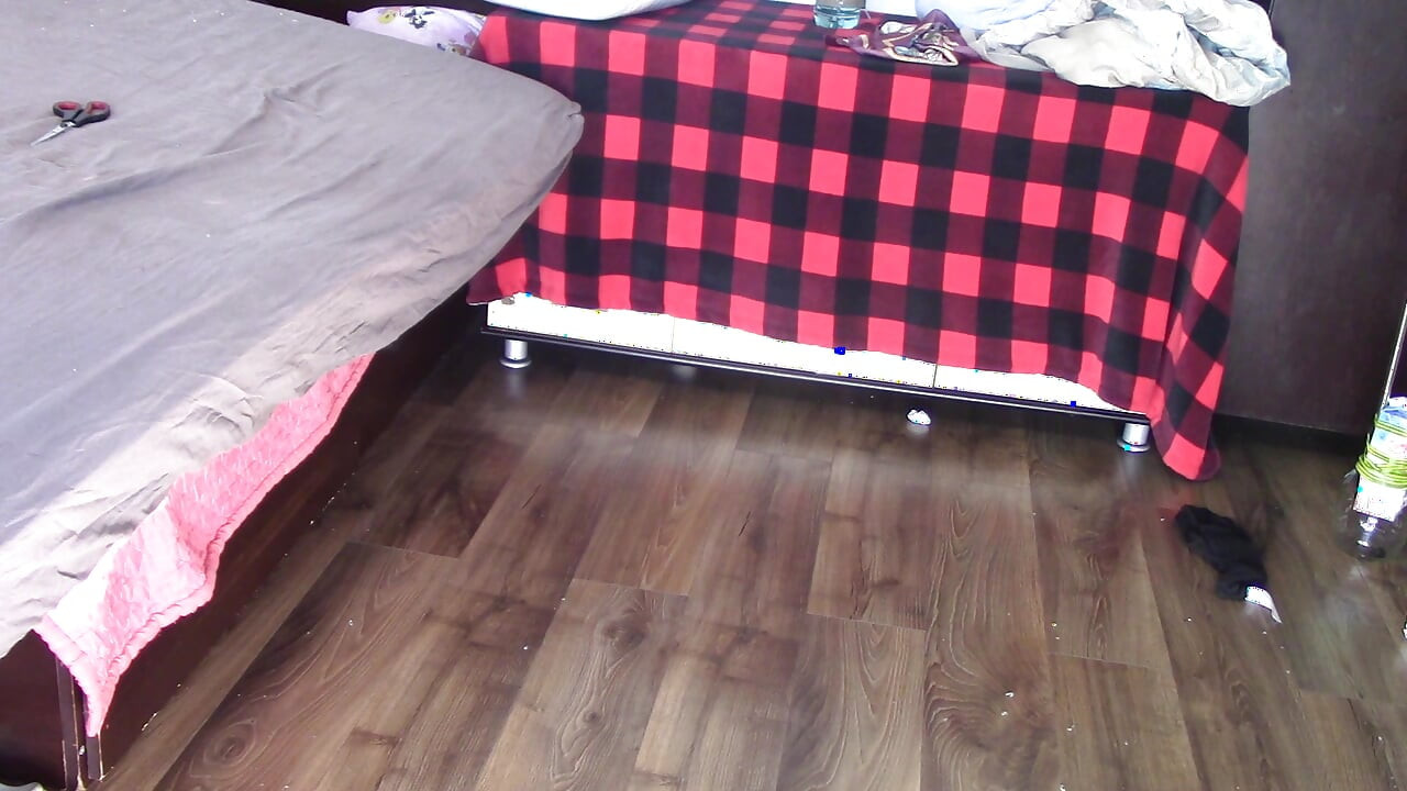 Amateur wife dancing and trying on clothes she cuts. Amateur wife vacuuming in bedroom.
