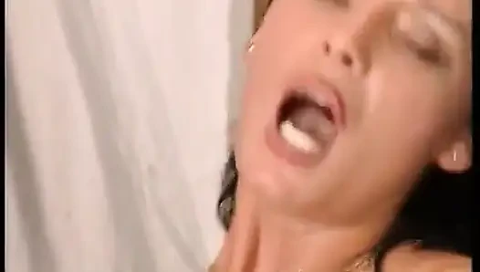 Sexy brunette in black stockings and nice tits rides a big cock