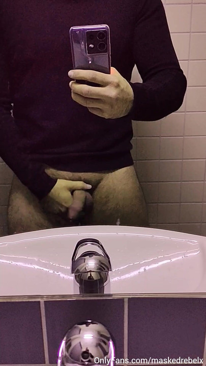 Hot man whips out his big soft cock in a public restroom