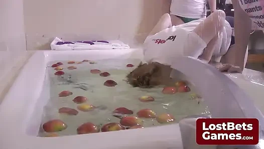 Four lesbians strip down while bobbing for apples