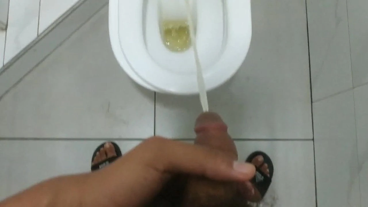 TEEN BOY PEEING IN TOILET.
