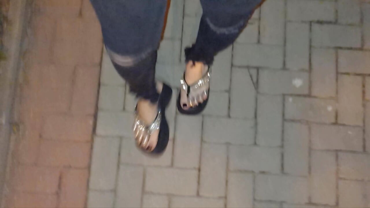 I wear platform flip-flops and tight jeans, showing off my feet.