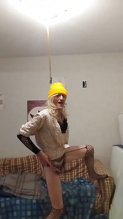 The blonde in the yellow cap shows off all excited...!! ...