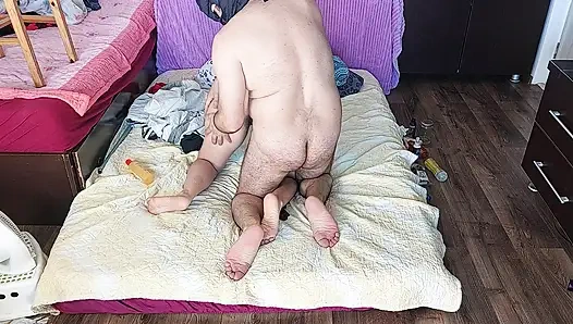 Sensual massage of a hot couple with oil on the body.