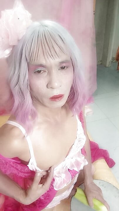 Transgender Oanh Le wears a sexy dress and masturbates.