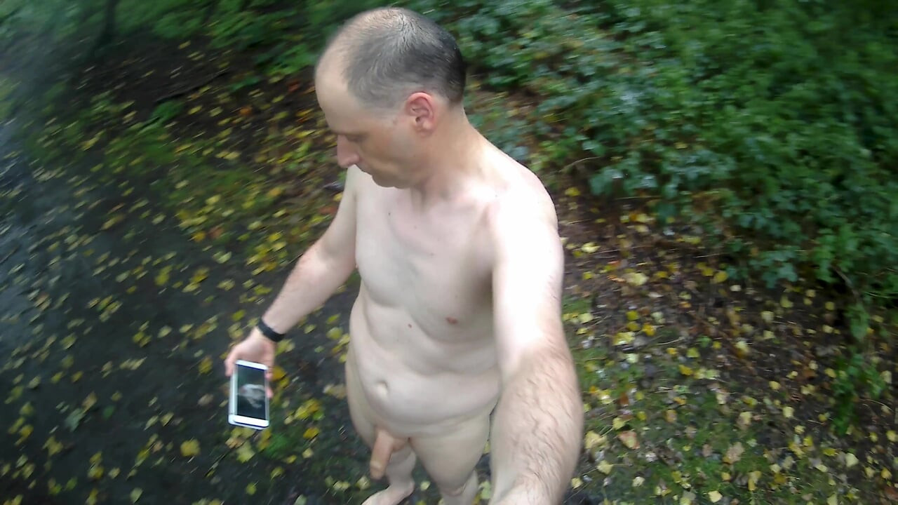 Jonathan outside strips naked walks and runs around wanking, it rains he sits wet in a muddy puddle masturbating