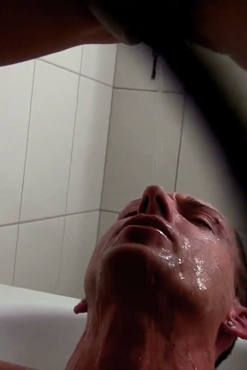 Pissing on her boy in the bathroom