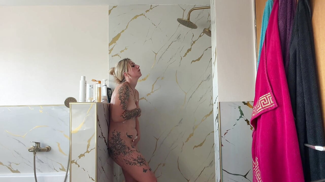 Blonde slut watched taking a shower