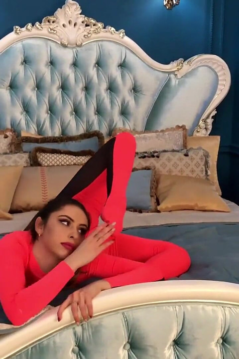 Stretching Flexibily on Hotel Bed