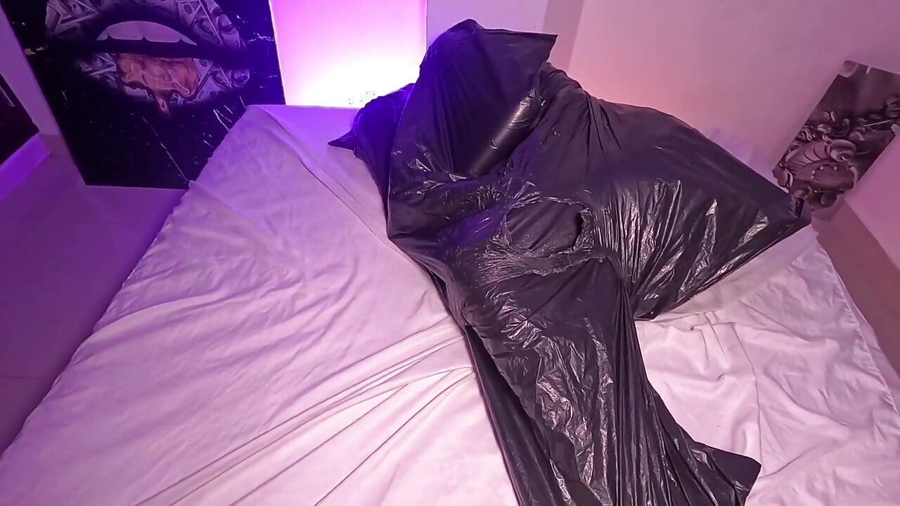 Girl in Garbage Bag Plays with Her Breath