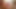 赤いおっぱいのブラジャーでおっぱいを見せつける少女