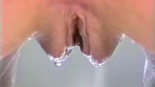 Pretty blonde masturbates while having a bubble bath