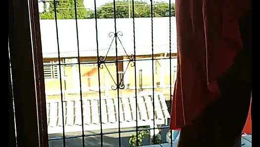 My stepmother trimming her hair and showing off to the street, filmed and sent me and asked if it was good.