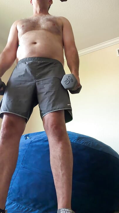 Lifting weights with my shirt off. My big sexy hairy chest is out in full force