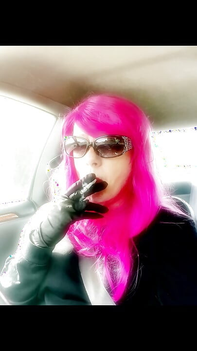 Mrs. Roman TG with Pink Hair and leather gloves smoking VS120s Menthol driving CD mature ladyboy smoking fetush