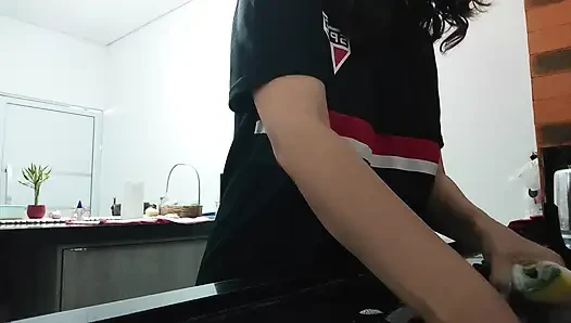 Woman teasing while washing dishes. She loves to transmit to the voyeurs on duty