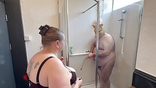 Domina Satana and Satana's piggy in the shower.