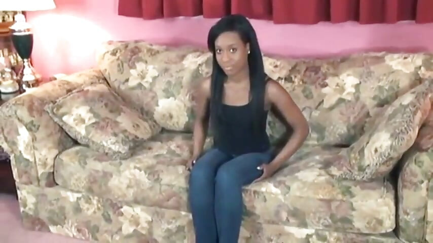Ebony chick with small perky tits strips on sofa