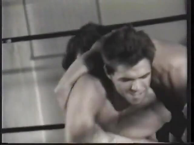 Two guys with ripped bodies are having a fight in the rink