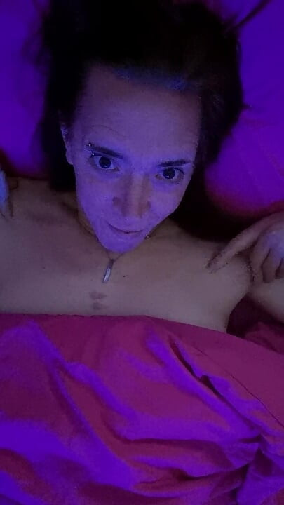 Trans playing in bed solo