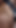Key moment from "Naughty sexy milf tries on naked clothes. Latina hairy pussy tries on clothes in bed."