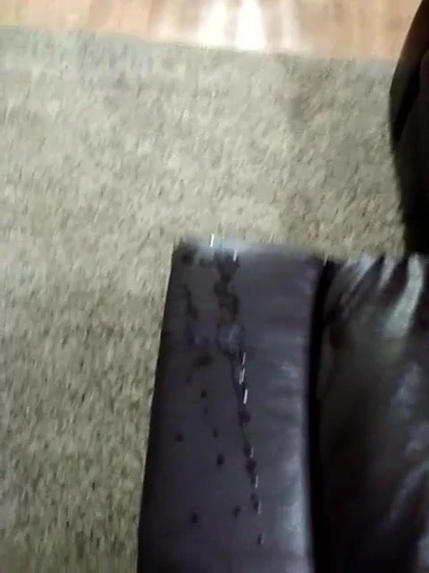 Cumming on leather sofa