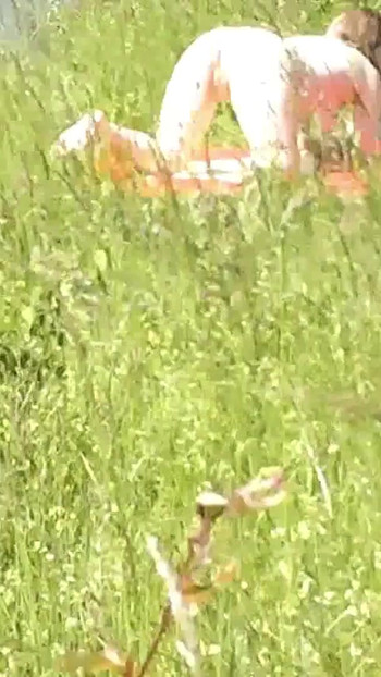 Iconic moment from "Milf sexy woman sunbathing naked on river bank. Naked in public. Wild beach Nudist. Ass. Pussy. Blonde."