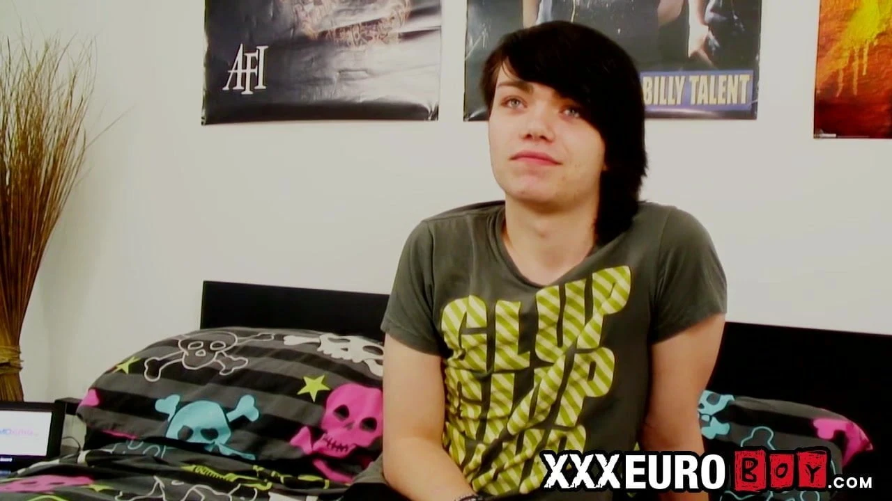 Young gay man with long hair strokes it hard