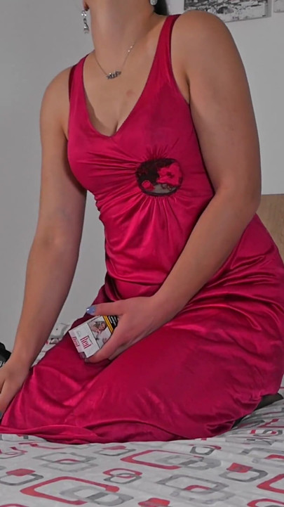 Tall brunette masturbating and smoking in sexy dress and nylons