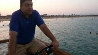 Yo con mi bicicleta en la playa