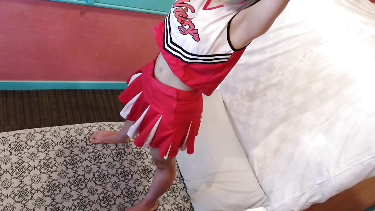 A cute, busty married woman performs exercise 4 in an erotic cheerleader costume. Peeking down from above. Home made amateur Private Shoot