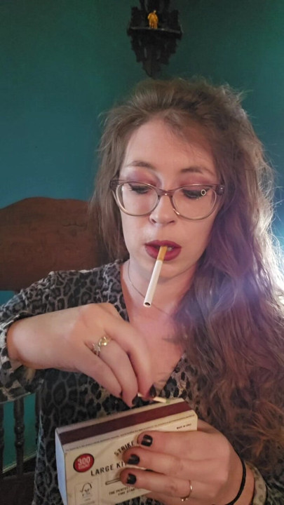 Cigarette Dangling while lighting a match