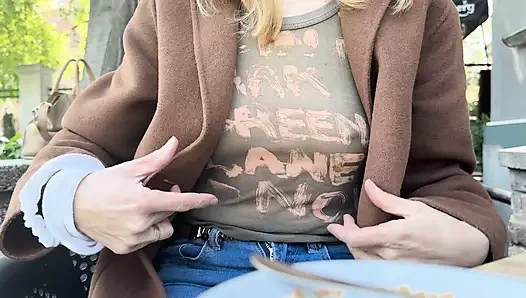 Teasing my husband in a sheer shirt exposing big pierced nipples in oudoor coffee place
