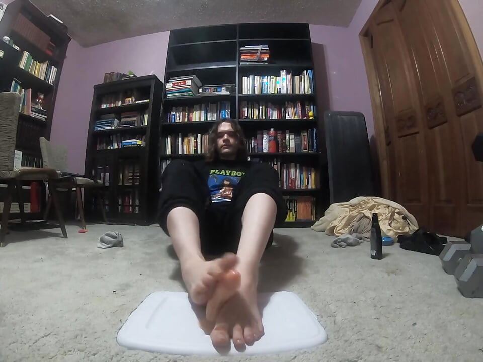 Chubby boy gives his dildo a footjob