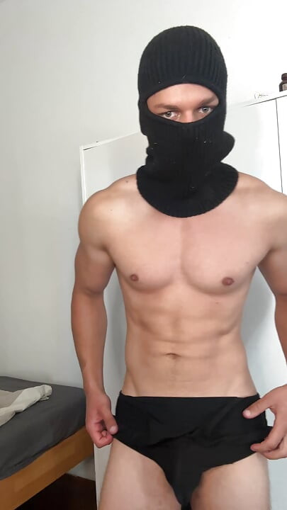 Muscle hunk teasing in a tight singlet