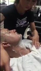 Barberette giving a face shave