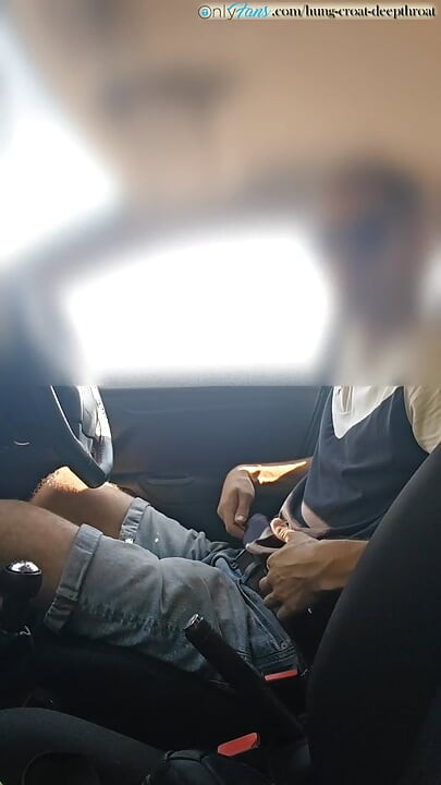 Cumming in a car by the road